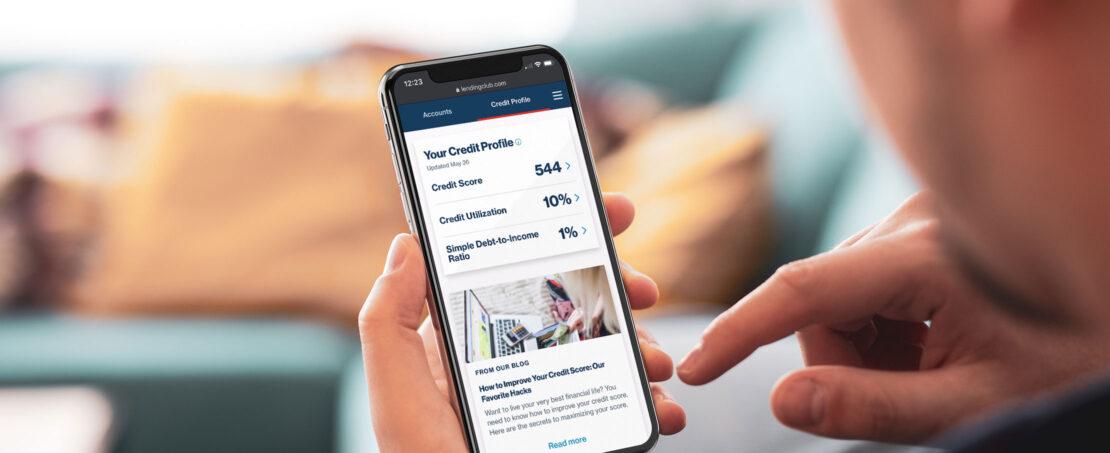hands holding iPhone navigating through LendingClub member center 